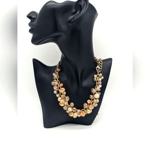 Vintage The Loft antique gold tone chains and an iridescent smoky oran cut glass